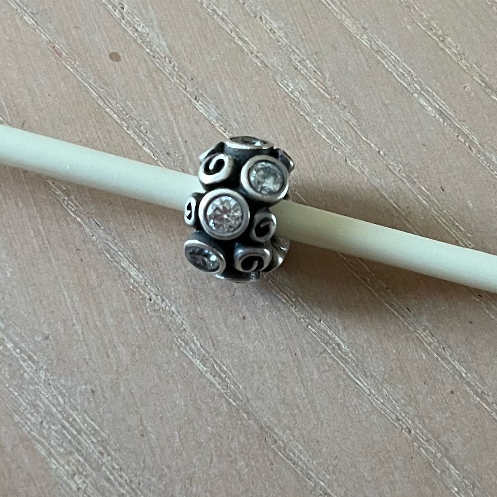Pandora retired Sterling Silver Primrose Path charm with clear CZ stones.